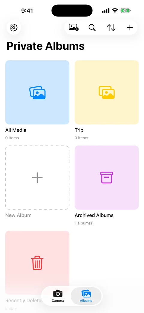 AtticAlbum private albums grid showing color-coded album cards with archive and trash sections